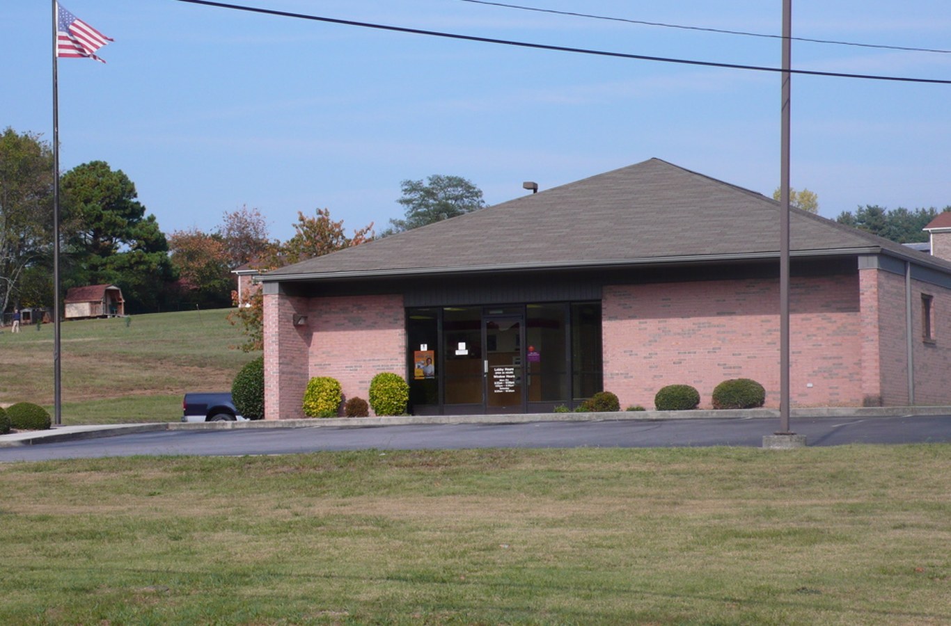 United States Post Office in Russellville, TN, a brick building with a flagpole out front