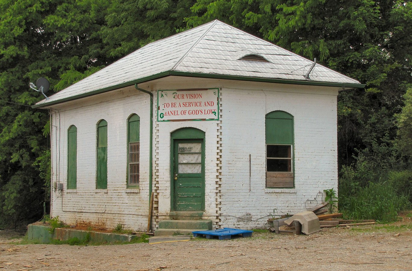 The white brick Talbott Farm and Garden building in Talbott, TN