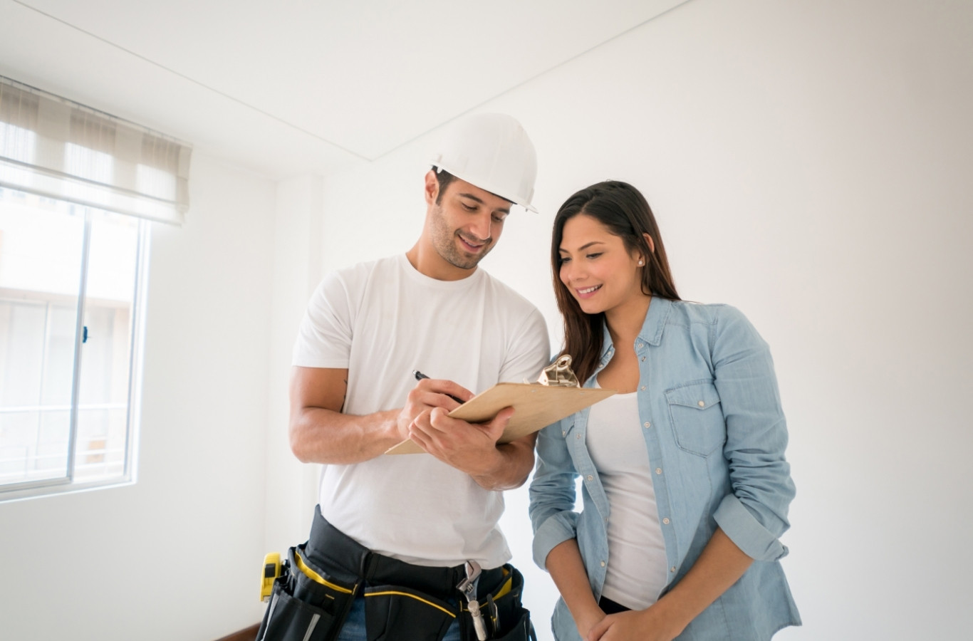 Contractor and homeowner reviewing a plan, as Starling Plumbing does in Sevierville, TN. Water Heater Services Near Me.