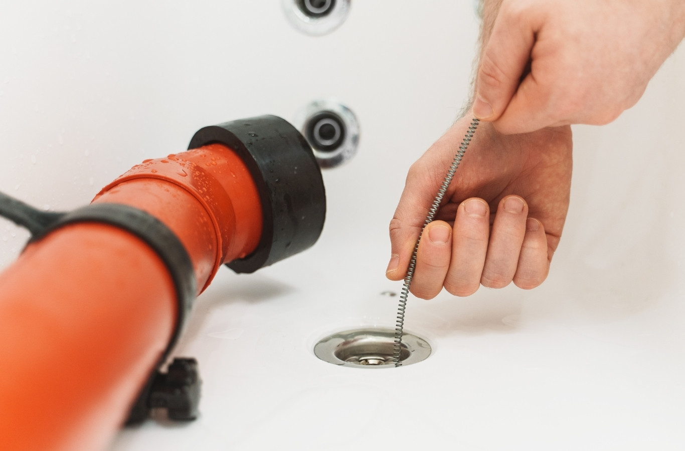 Drain cleaning machine clearing a clogged bathroom sink, the kind of job Starling Plumbing does in New Market, TN homes