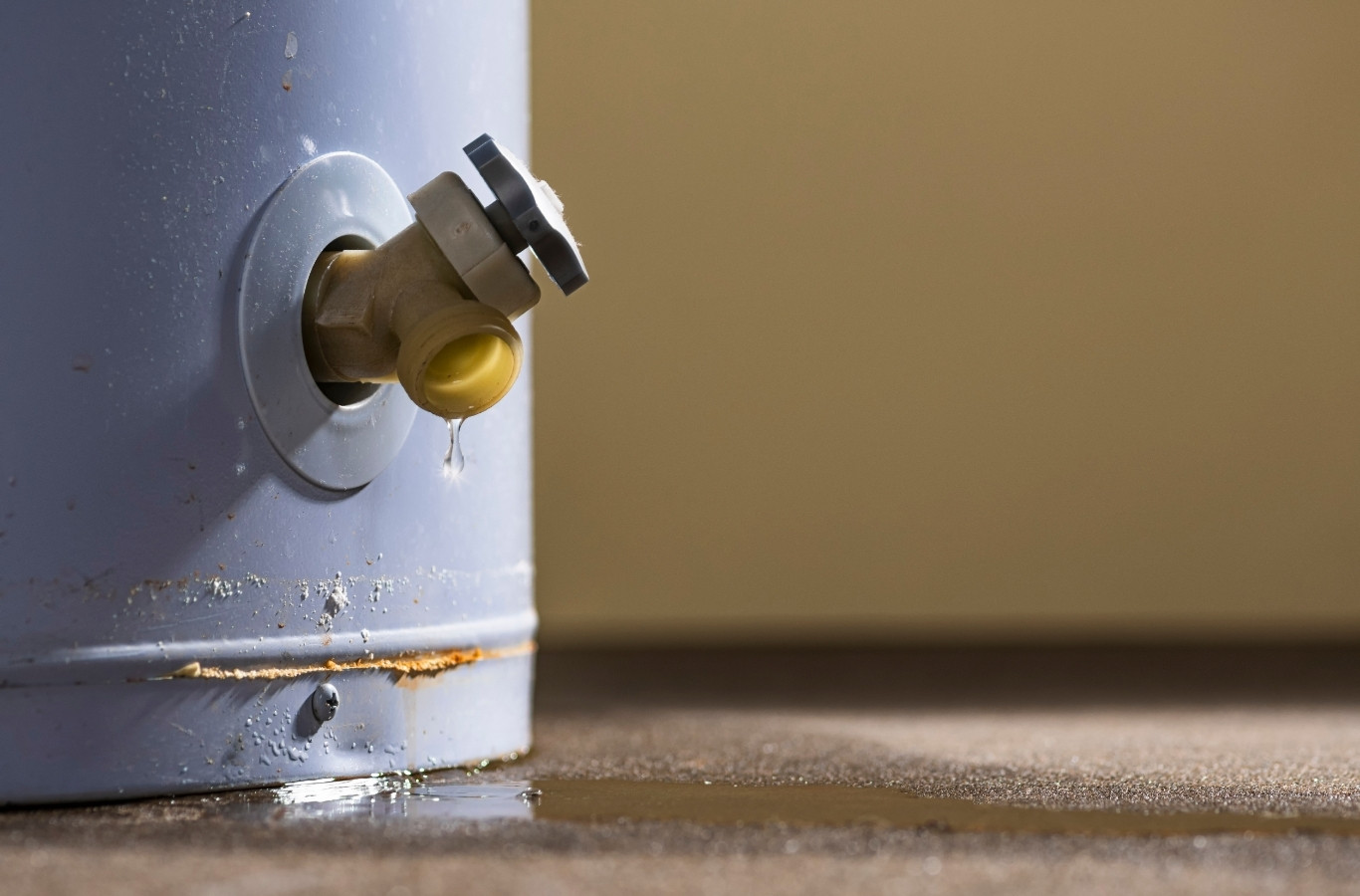 Drain valve dripping near rust at the base of a tank, the upkeep Starling Plumbing handles for White Pine, TN heaters