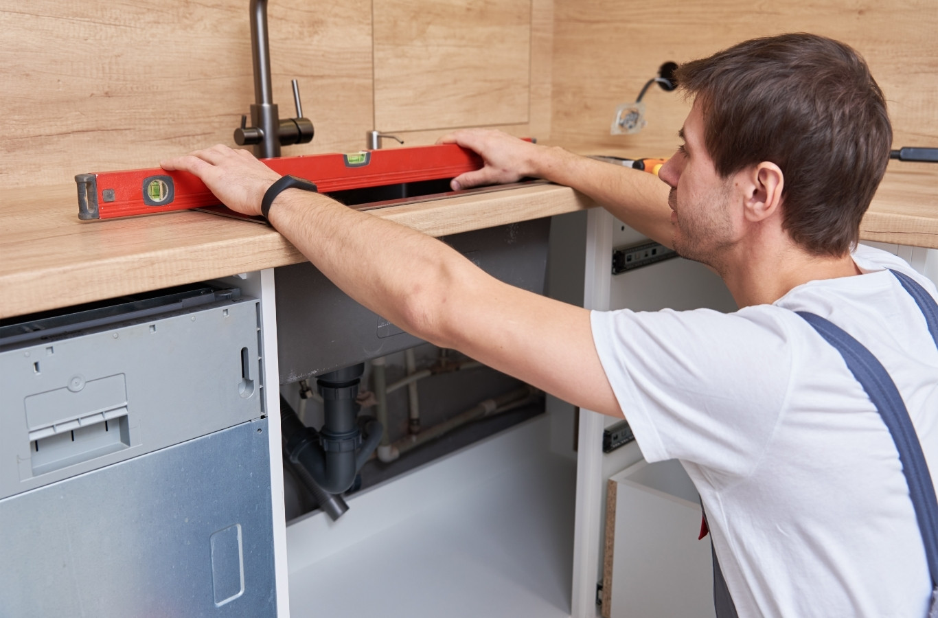 Plumber leveling a countertop for a new sink, work by Starling Plumbing in Jefferson City, TN. Plumber Near Me.